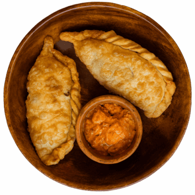 Red Chilli Ema Datshi Shapaley - Bhutanese fried pies stuffed with red chilli ema datshi filling Bhutan Kitchen Bangkok Menu item