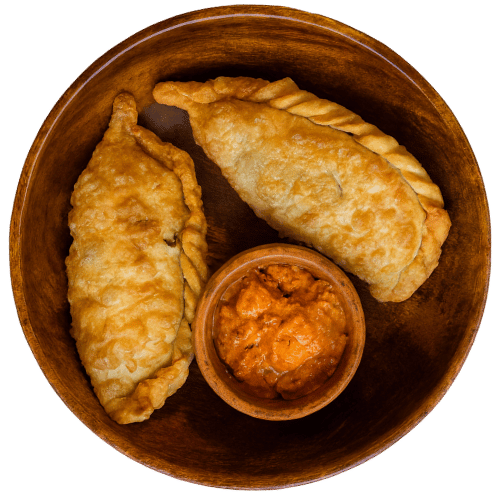 Red Chilli Ema Datshi Shapaley - Bhutanese fried pies stuffed with red chilli ema datshi filling Bhutan Kitchen Bangkok Menu item